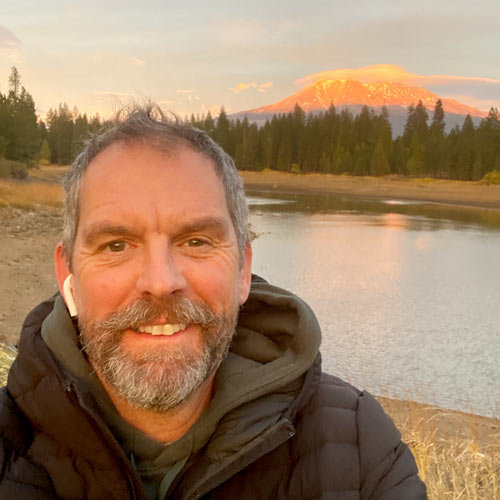 Dickon Kent in front of lake
